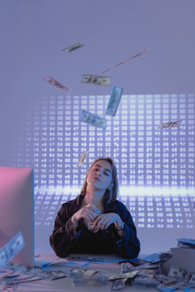 woman with tons of cash and sudden wealth syndrome