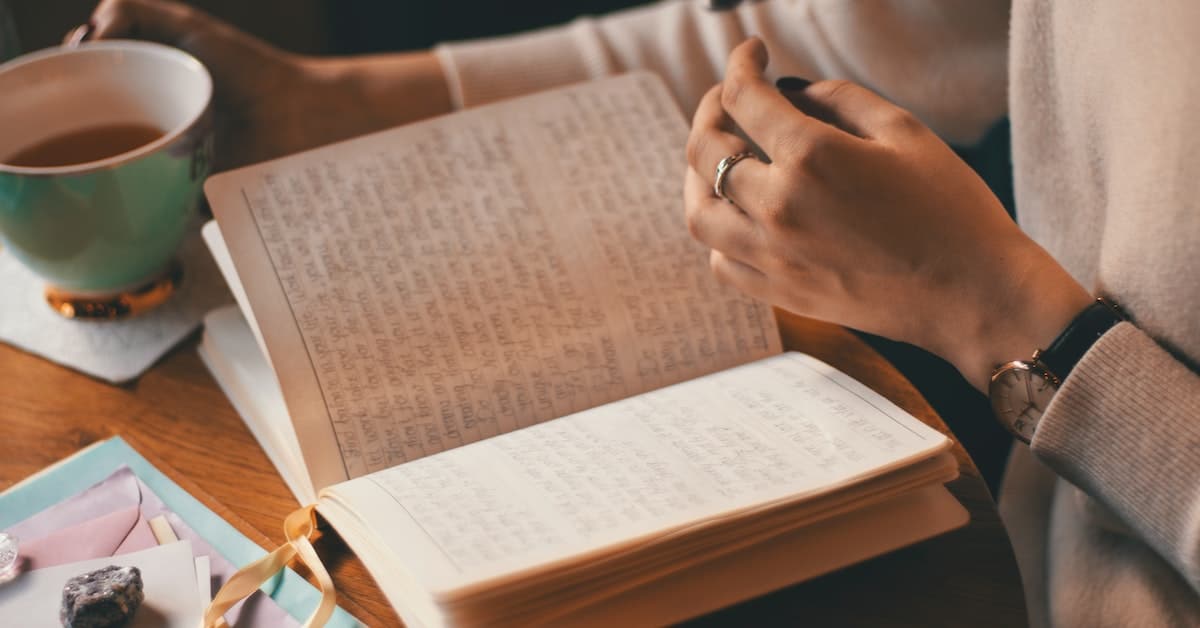 woman with journal and coffee learning to get over what others think