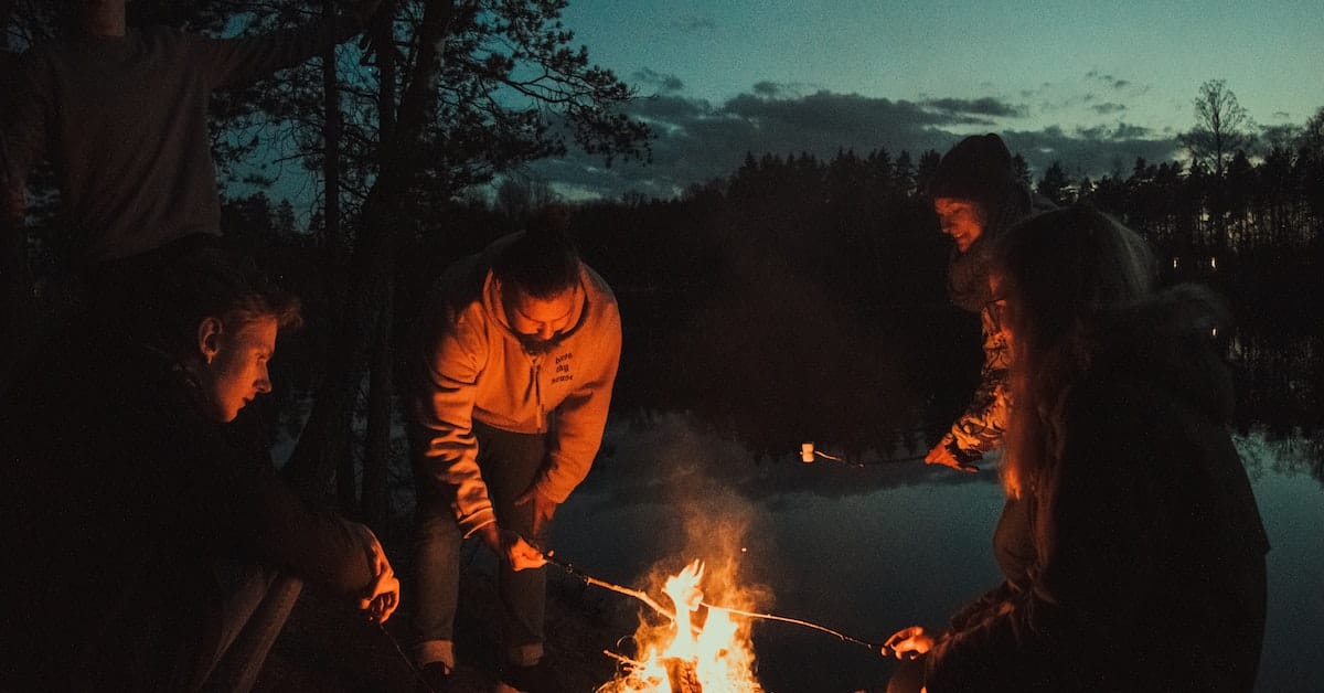 good friends around campfire 
